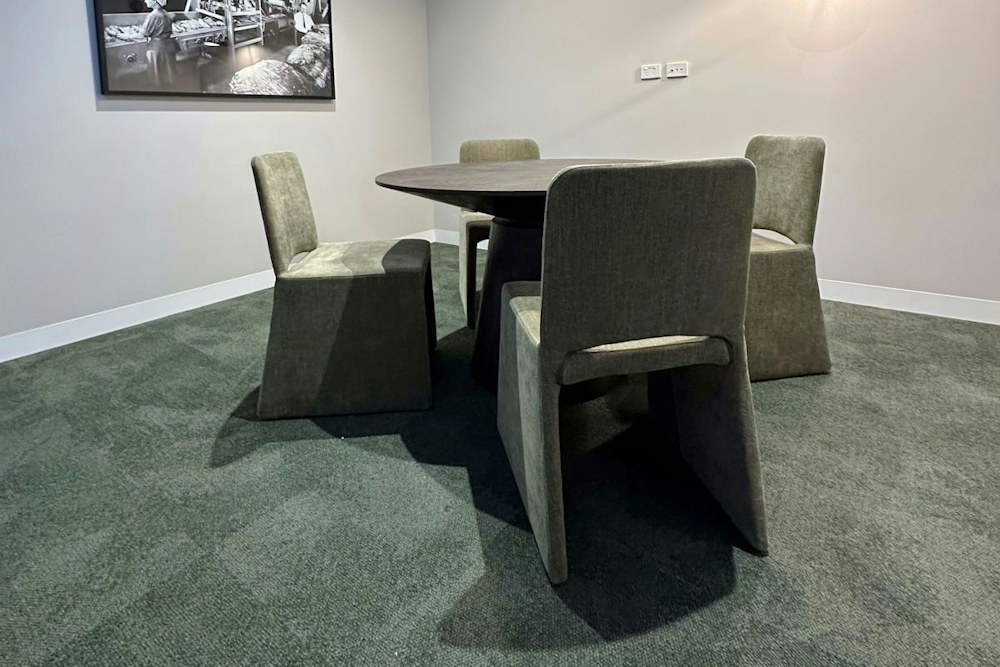 A small Morris Moor meeting room with a round table and four chairs